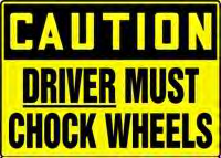 Driver Must Chock Wheels plastic sign